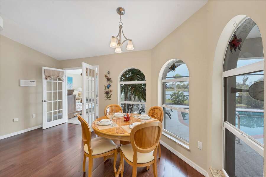 Kitchen nook with pool & canal view. Table seats 4