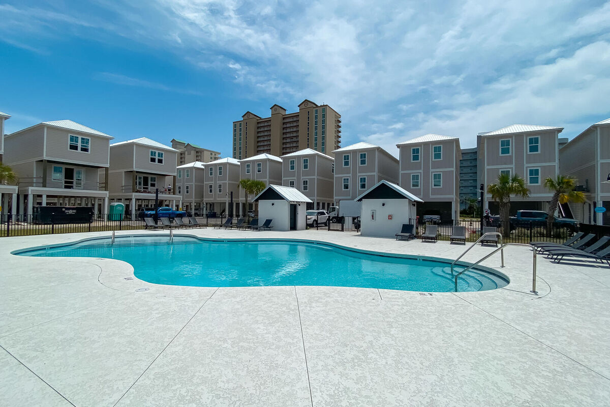 Soak in the sun and coastal breeze next to the community outdoor pool
