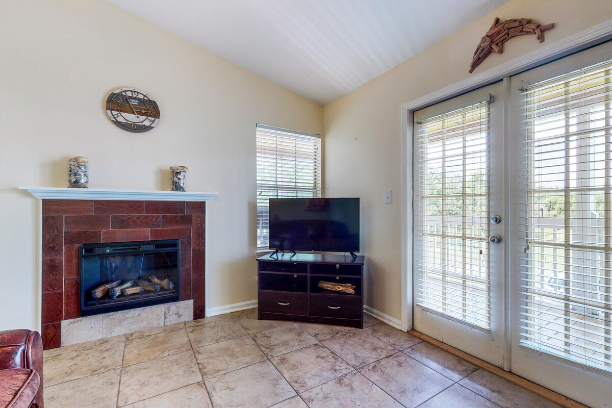The living room features a fireplace and Smart TV for streaming your favorite movies or TV shows.
