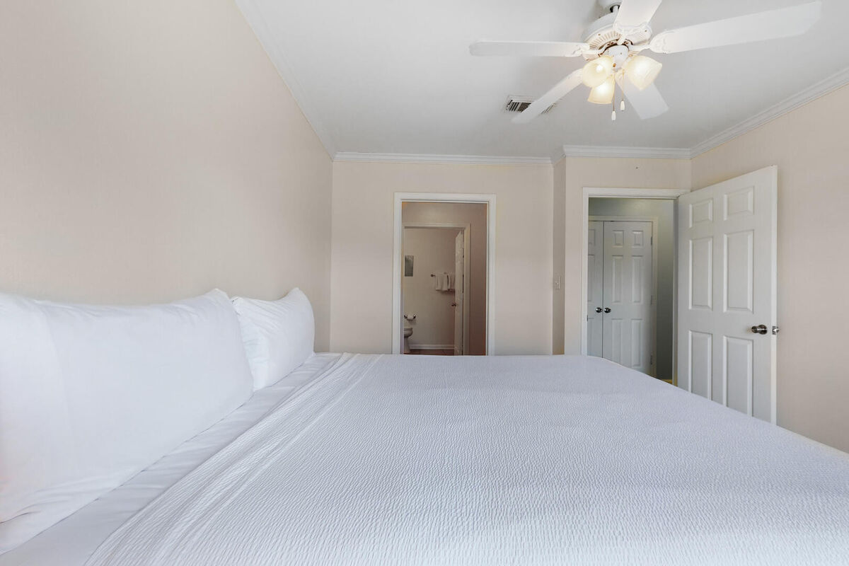The master bedroom boasts a comfortable king size bed and en-suite bath