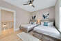 The 1st guest bedroom boasts 2 double beds