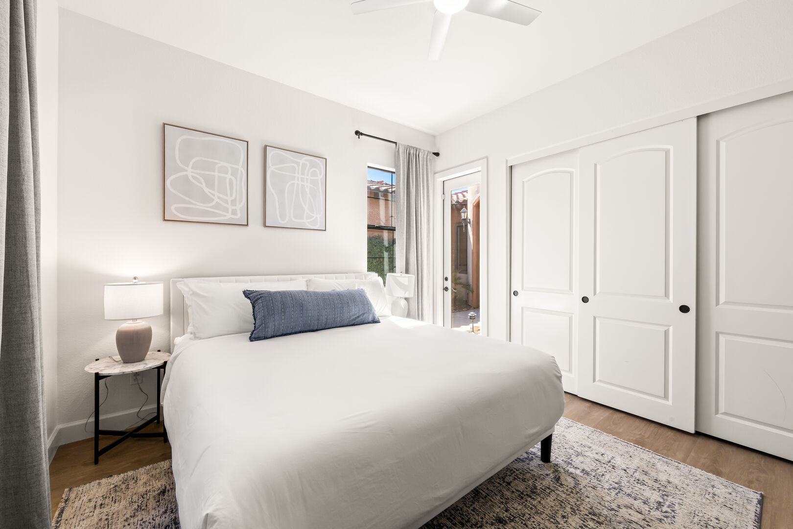 Bedroom 5 is located across Suite 2 and features a King-sized Bed, 55-inch Samsung 4K Smart television, remote-controlled ceiling fan, and a large reach-in closet.