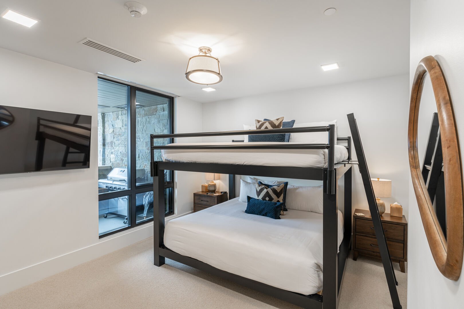 Guest suite features a queen over queen bunk bed.
