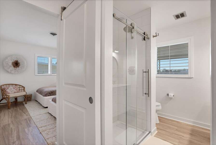 Shared bathroom with Walk-in shower