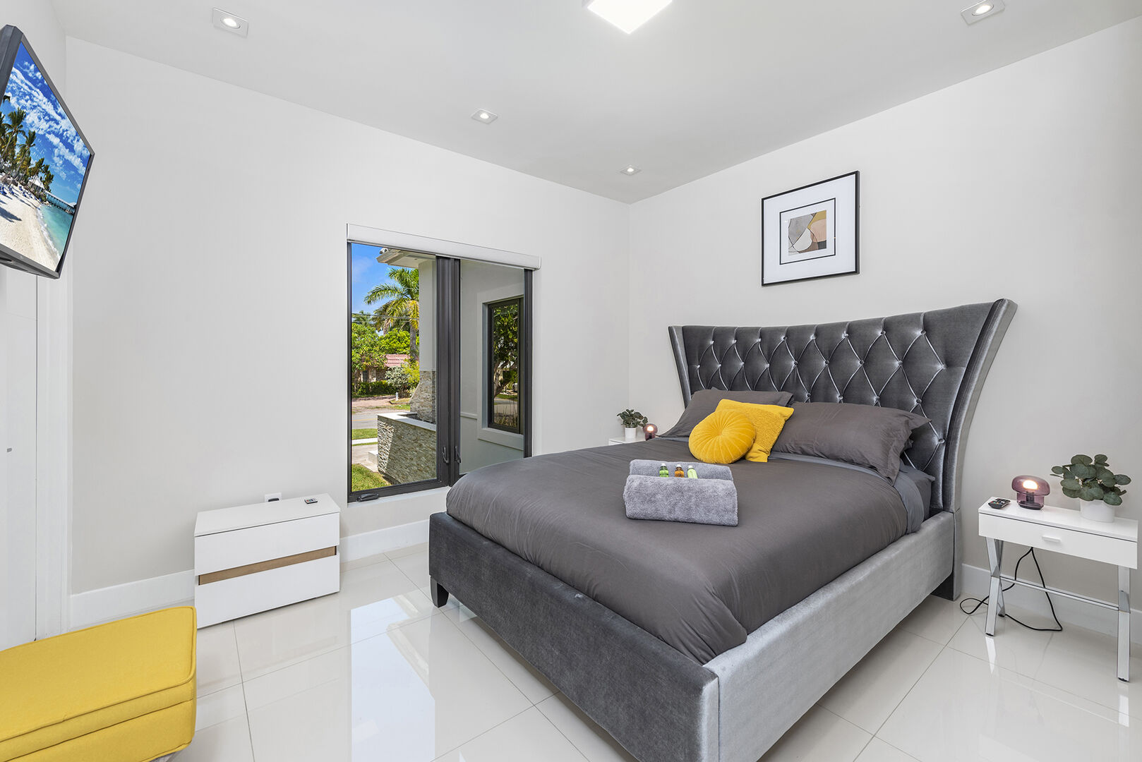 The fifth bedroom with lots of natural light features a king size bed and ensuite bathroom.