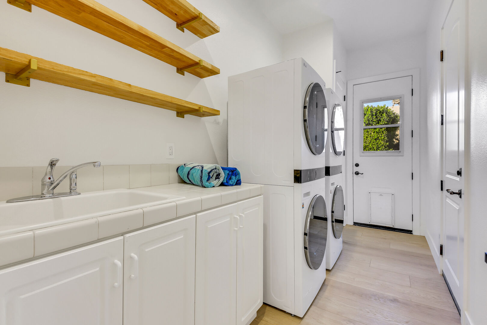 In the fully equipped laundry room, you'll find a washer, dryer, iron, ironing board, and laundry pods for convenience.