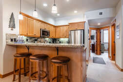 Fully Equipped Kitchen with kitchen bar and 3 stools