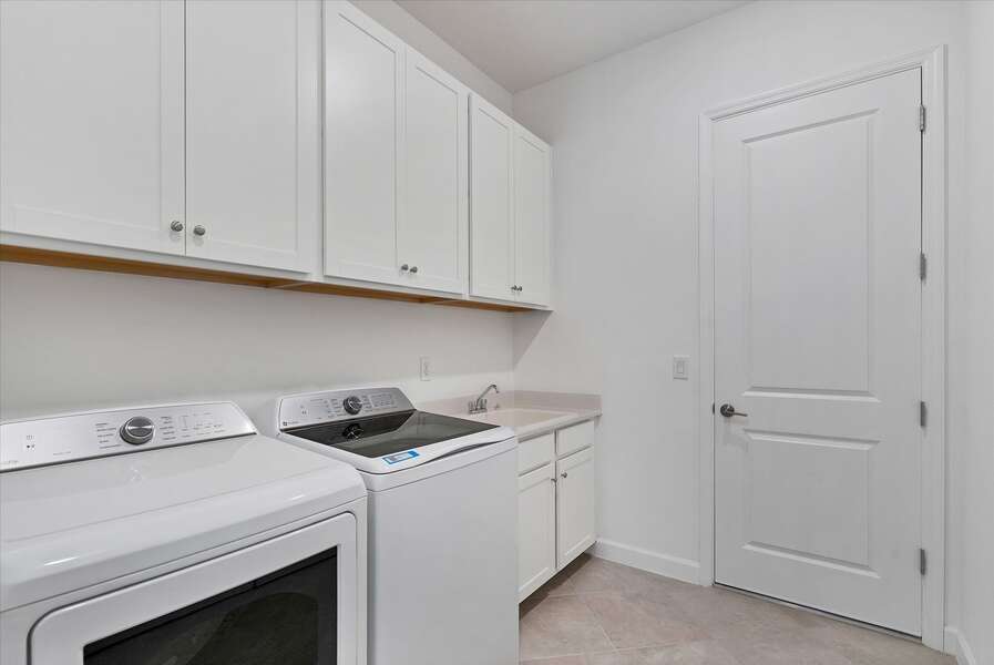 Laundry room featuring full-sized washer and dryer