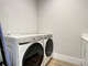 Front loader washer and dryer with folding area.