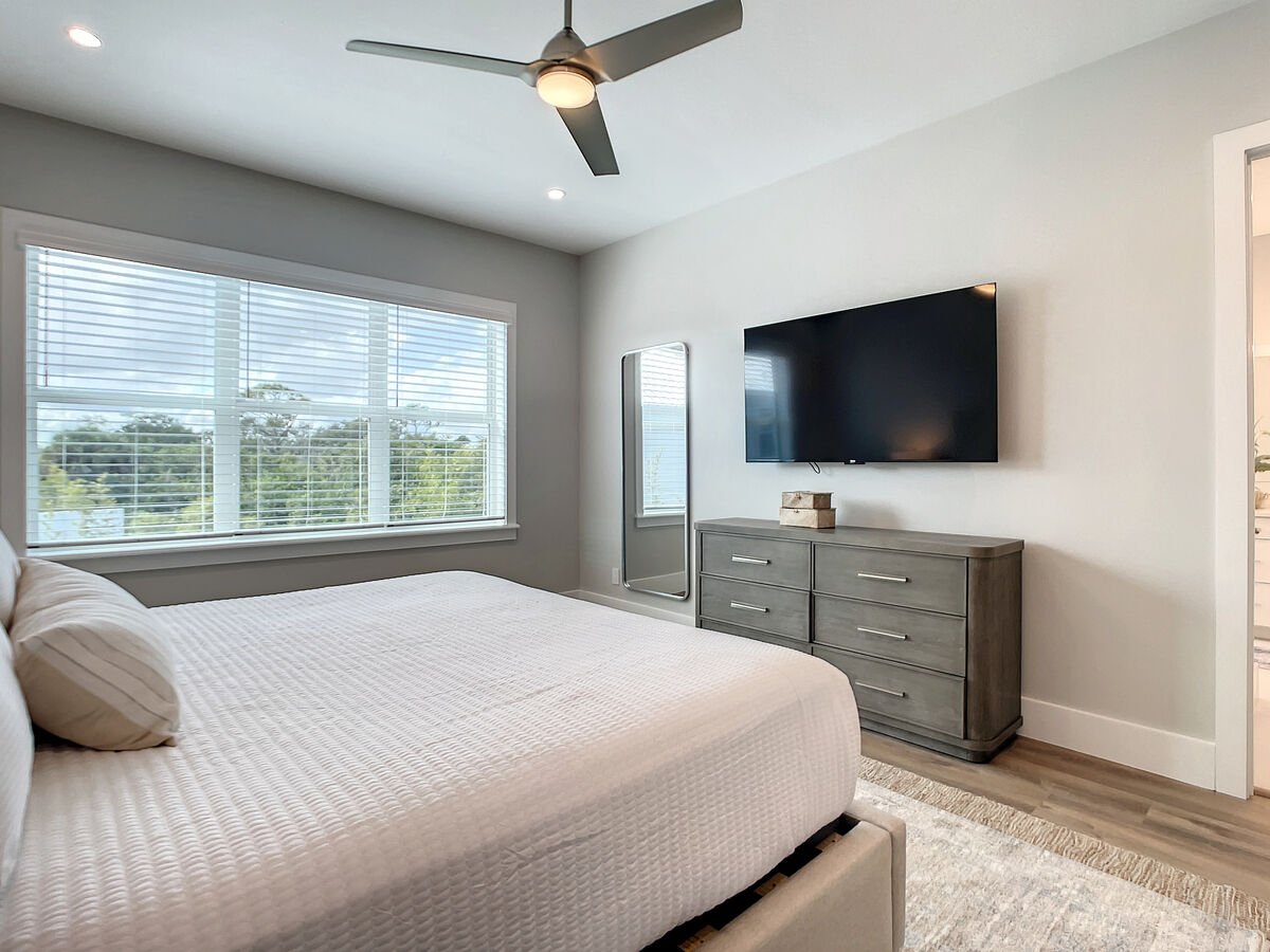 Retreat to our master bedroom with a king bed and double sink bathroom, featuring a lavish walk-in shower for ultimate relaxation.