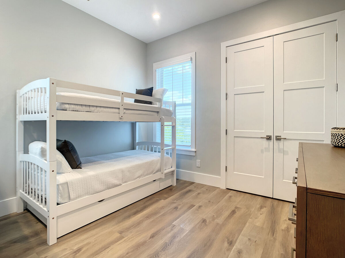 Our kids' room features two sets of twin bunk beds, perfect for little explorers, with a full-size bathroom just steps away.