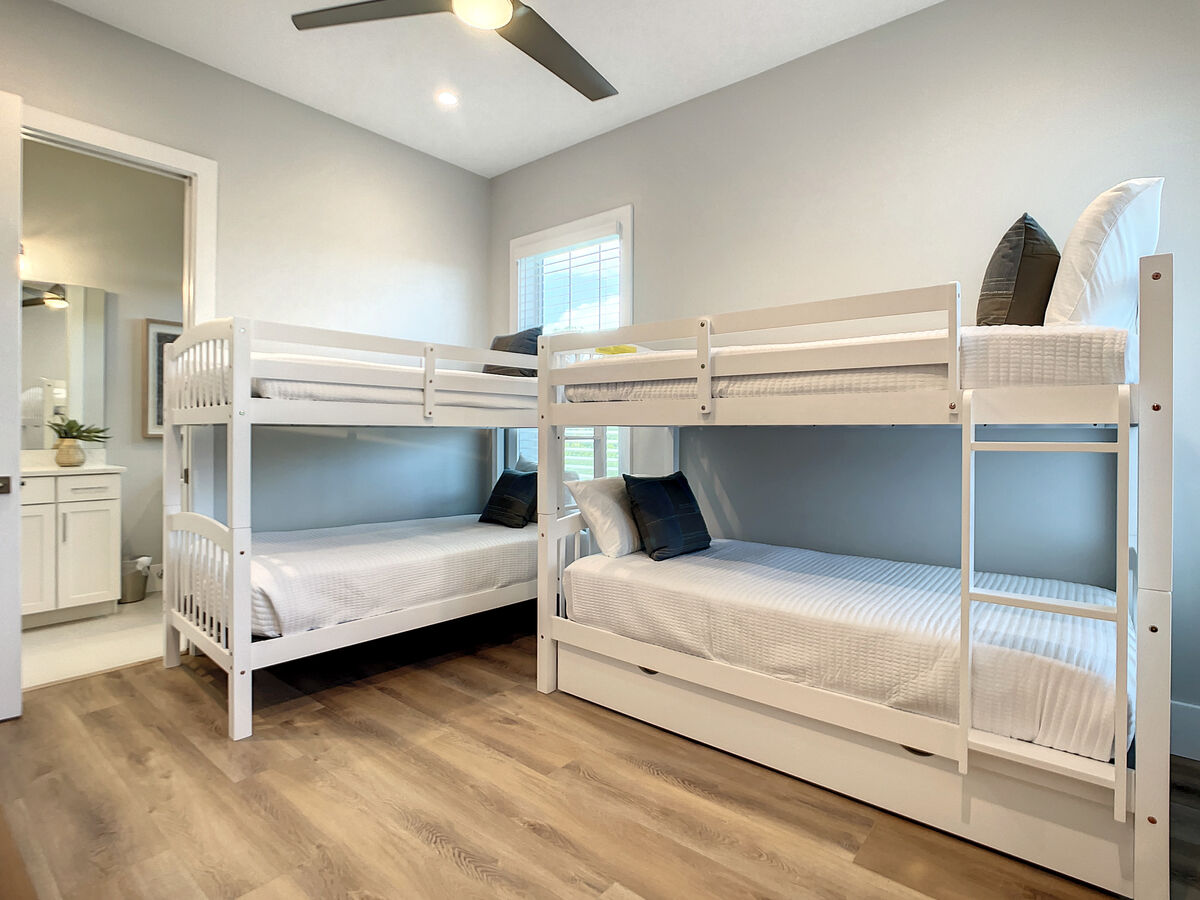 Our kids' room boasts bunk beds galore, providing a cozy retreat for young adventurers, plus a full-size bathroom for easy cleanup