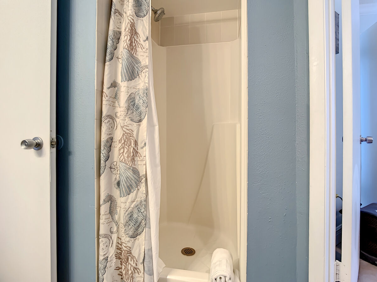 Walk in shower. Access to master and guest bathroom.