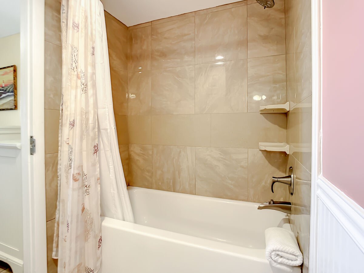 Shower tub combination. Access to the guest room.