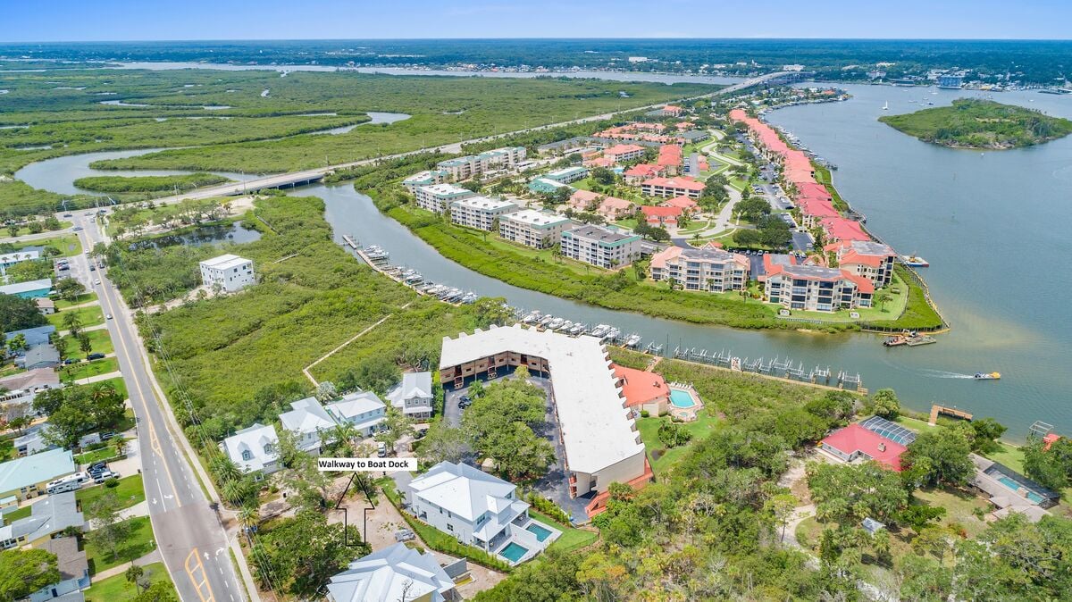 Take in the stunning aerial vista of our 3-bed, 3-bath oasis with a private pool, nestled near the tranquil canal.