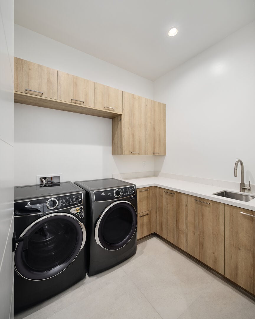 Laundry room offering washer and dryer appliances available for use during your stay.