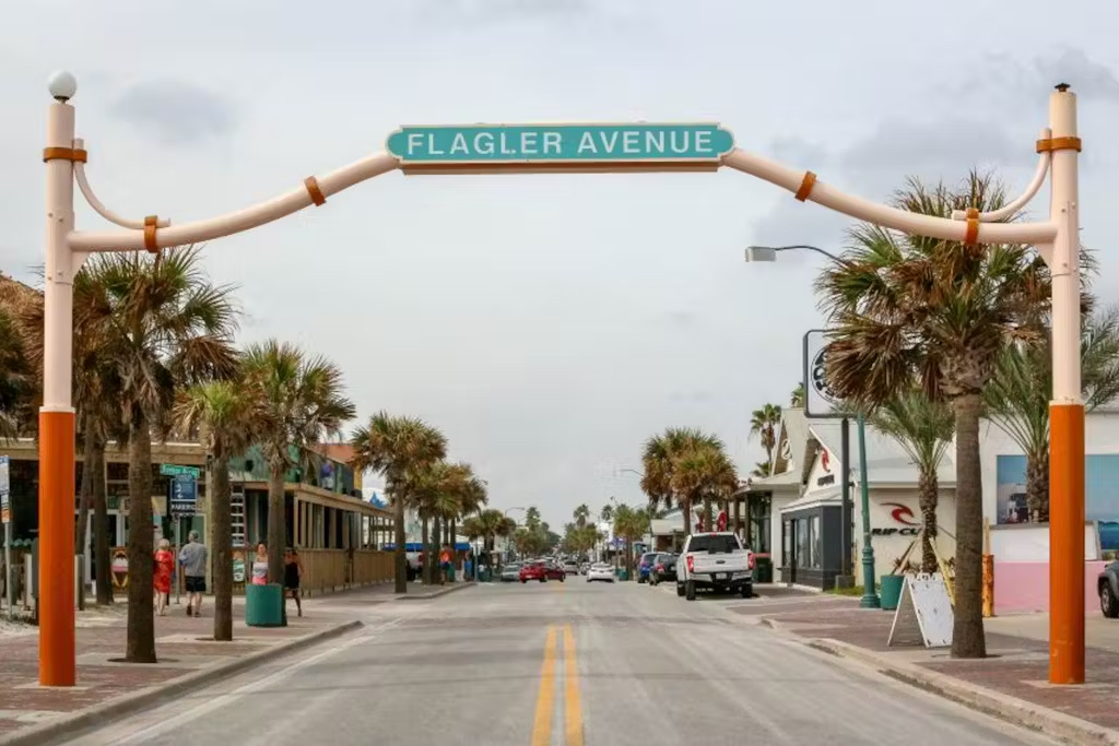 Discover the charm of Flagler Avenue, lined with palm trees, local shops, and coastal energy – a perfect stroll destination.
