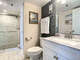 Vanity with storage and walk in shower.