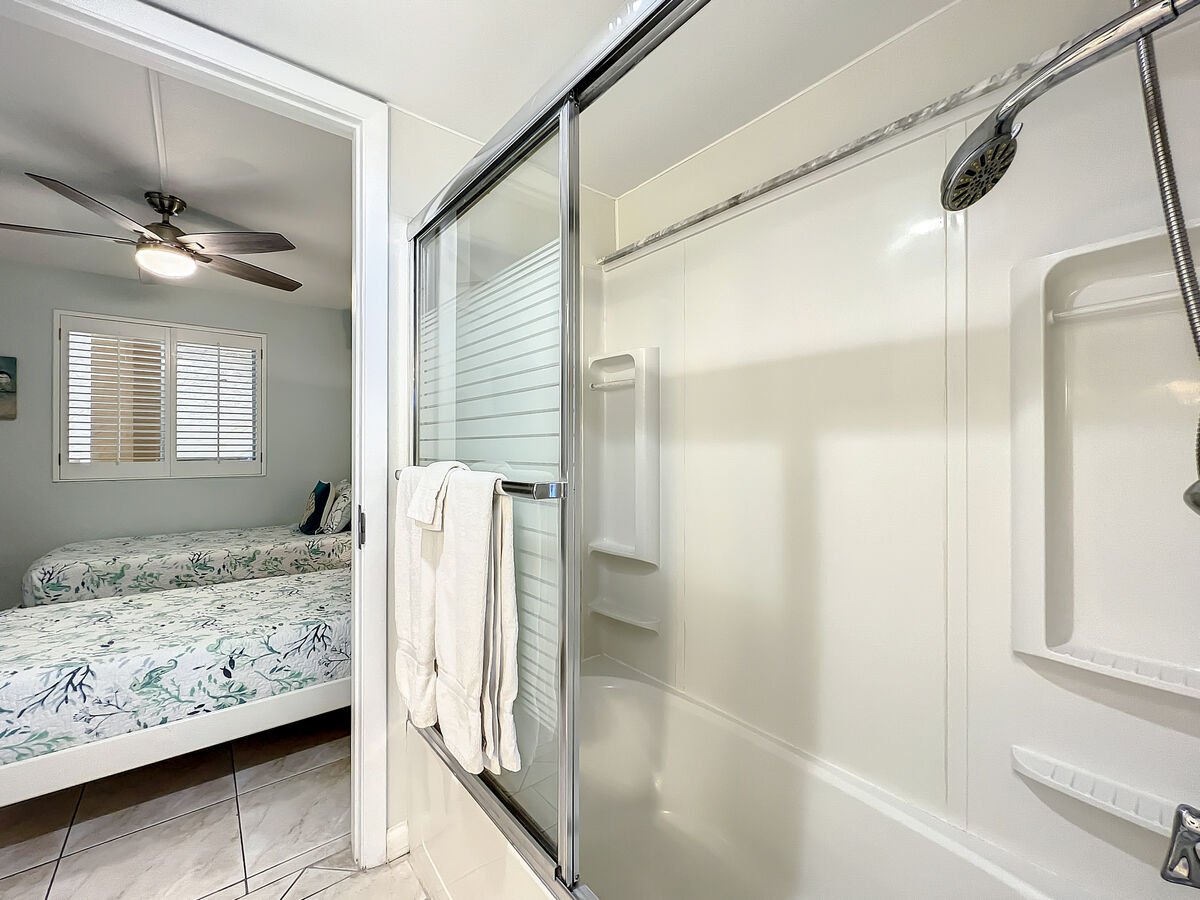 Shower tub combination with access to guest room