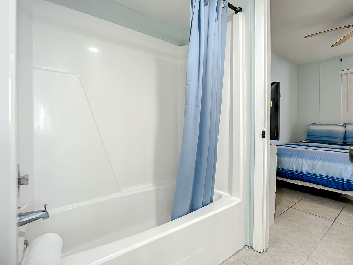 Shower tub combination with access to guest room.