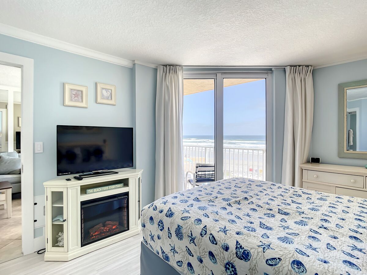 Views of the ocean equipped with a TV and fireplace.