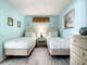 2 Twin beds with beach decor.