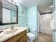 Vanity with storage. Shower tub combination.