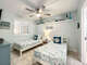 2 twin beds with ceiling fan.