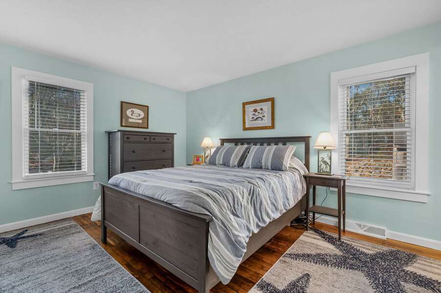 Bedroom #2 is the Primary bedroom and offers a Queen sized bed, plenty of sunlight and an en suite bathroom with shower - 14 Quail Nest Run Harwich Cape Cod-Hawksnest Hideaway-NEVR