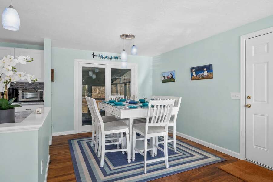 Dining area provides access to the enclosed porch as well as the outdoor spaces - 14 Quail Nest Run Harwich Cape Cod-Hawksnest Hideaway-NEVR