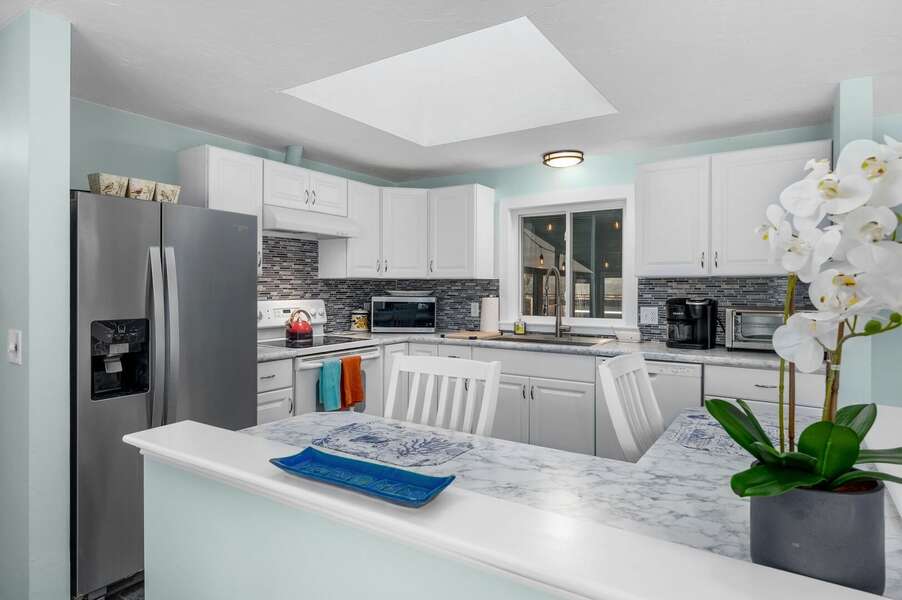 Spacious and sunlit kitchen with counter seating for two - 14 Quail Nest Run Harwich Cape Cod-Hawksnest Hideaway-NEVR