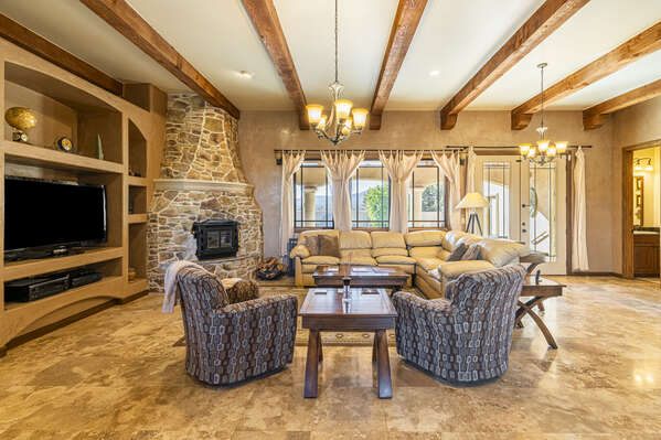 Spacious Main Living Room with High Wood Beam Ceilings