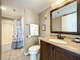 Shower tub combo. Sink vanity and full size toilet. Towel racks and storage available.