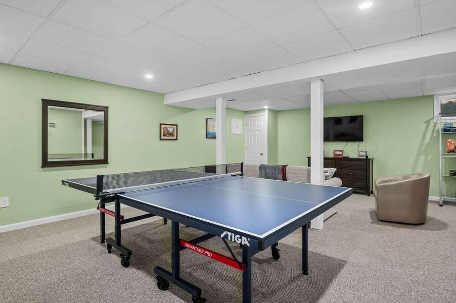 Challenge someone to a game of ping pong or choose a movie to watch in the lower level recreation space - 9 Alonzo Road Harwich Port Cape Cod - Don't Think Twice - NEVR
