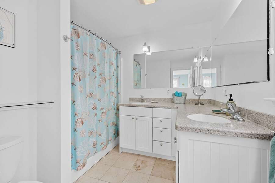 En suite primary bathroom (#1) offers a tub/shower combination and double vanity - 9 Alonzo Road Harwich Port Cape Cod - Don't Think Twice - NEVR