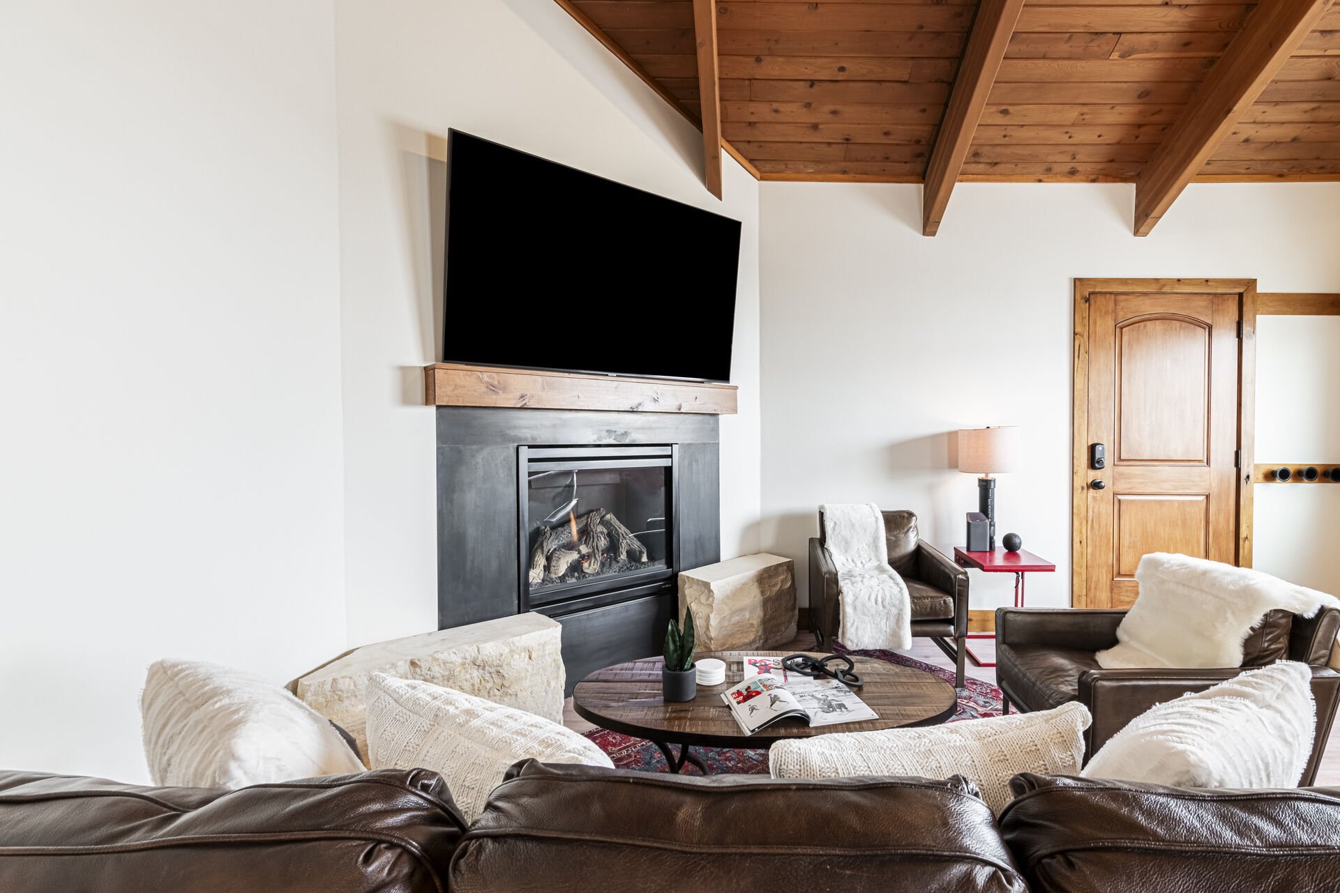 Living Area with Gas Fireplace, Leather Full-size Sleeper Sofa, and Smart TV