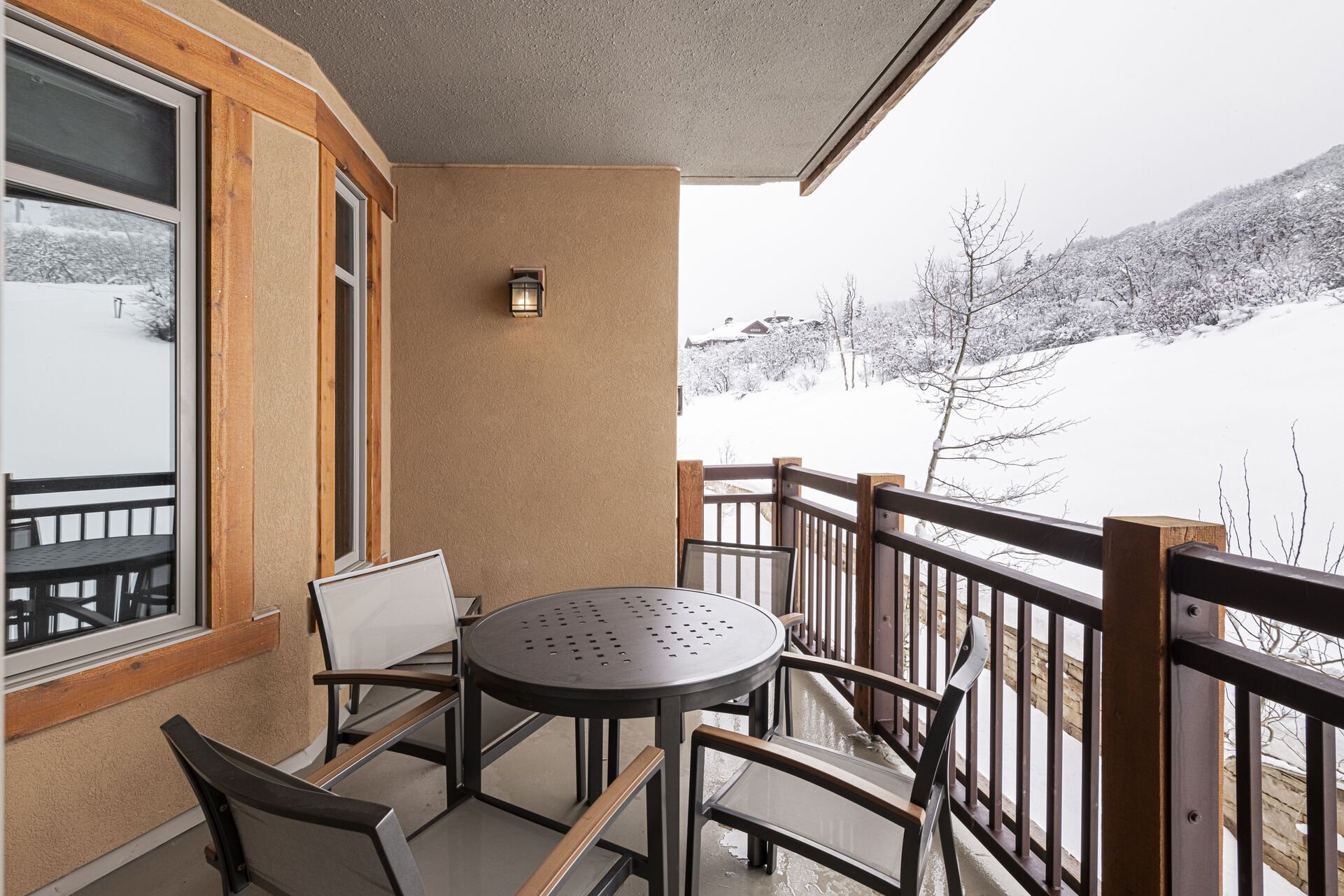 Private balcony with outdoor seating for 4 adjacent to the living area