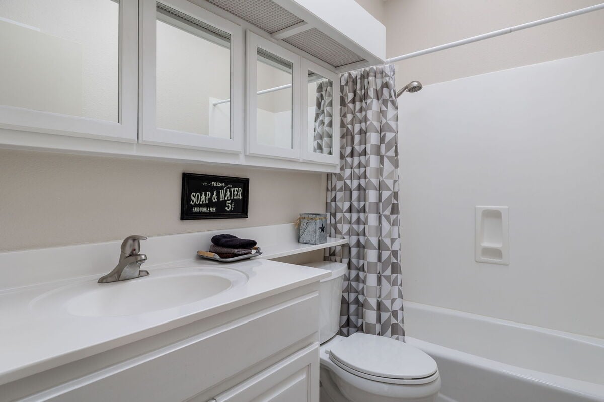 Full bathroom with combined shower and hot tub. Pack light as we provide towels and complimentary bath essentials.