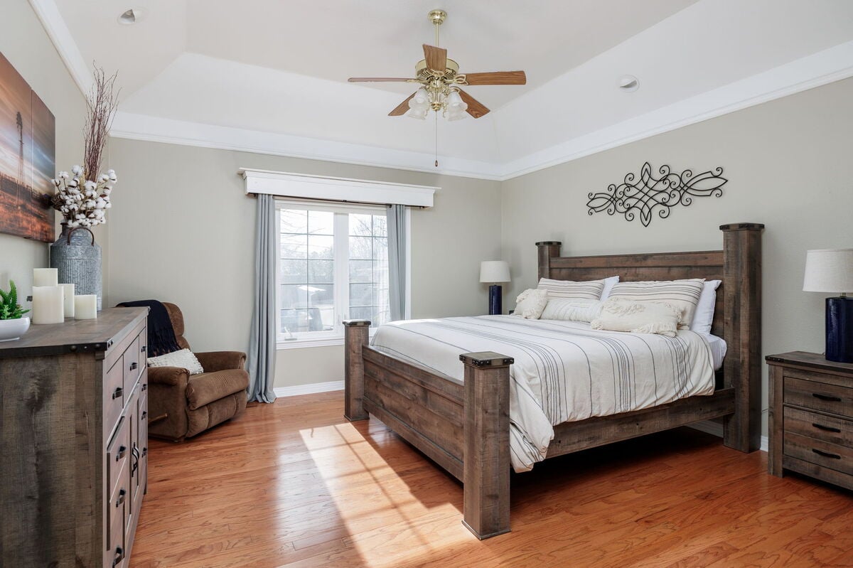 The master bedroom features a luxurious king-sized bed.