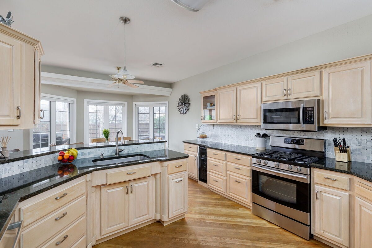 Whip up delicious dishes in our fully equipped kitchen, featuring modern appliances, ample counter space, and a breakfast bar for casual dining or morning coffee.