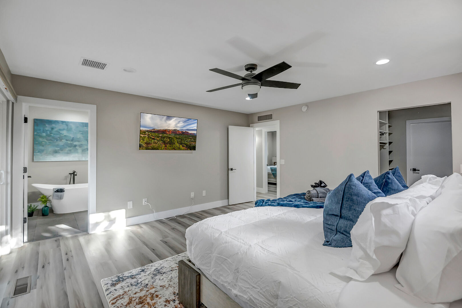 Master Bedroom (Main Level) with a king bed and 55” smart TV