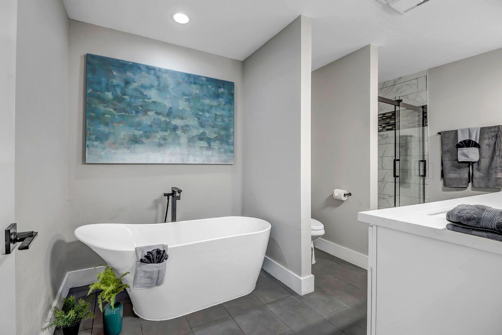 Master bathroom with double vanities, soaking tub and separate walk-in shower