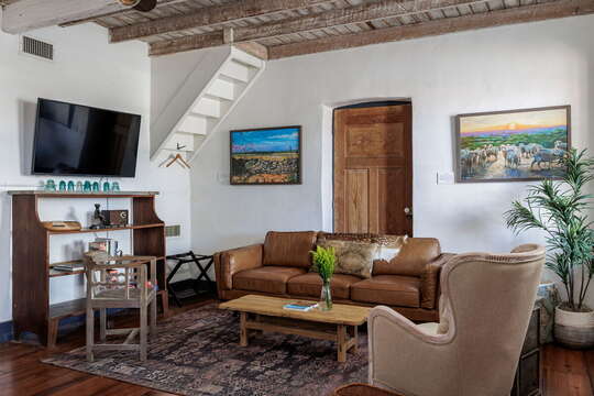 Experience comfort and style in the living room, a cozy retreat adorned with rustic charm and unique decor