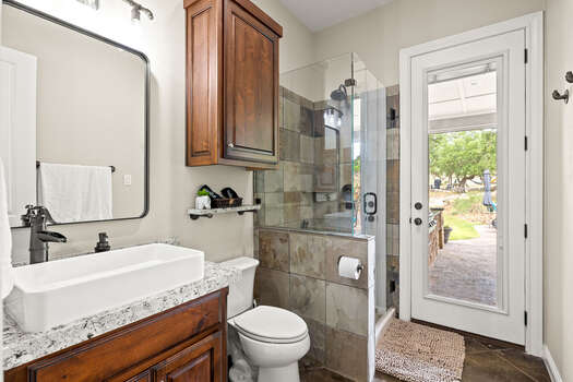 Full Shared Bathroom Two with Glass Shower and Access to Backyard