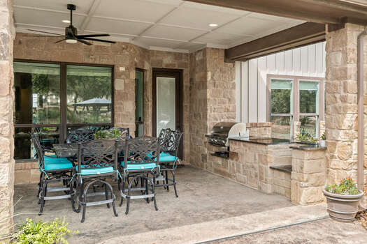 Expansive Covered Patio with Outdoor Dining and Built in BBQ