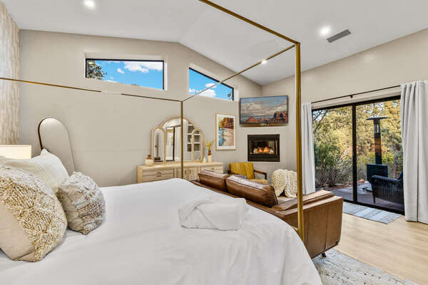 Master Bedroom- King Bed, Sofa Seating, Gas Fireplace and Backyard Space