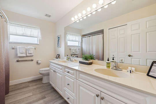 Guest bathroom with a combination tub/shower & double sinks!