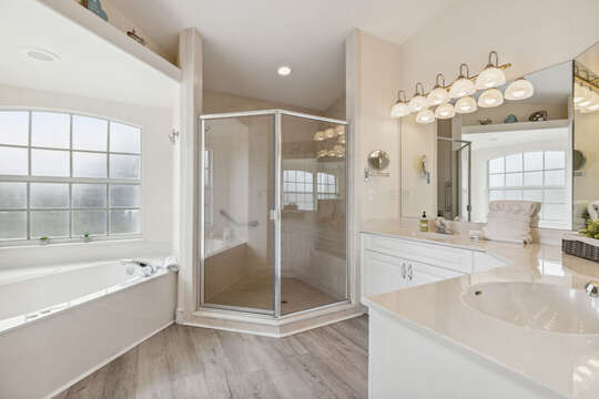 Master bathroom features an ADA accessible stand-up shower.