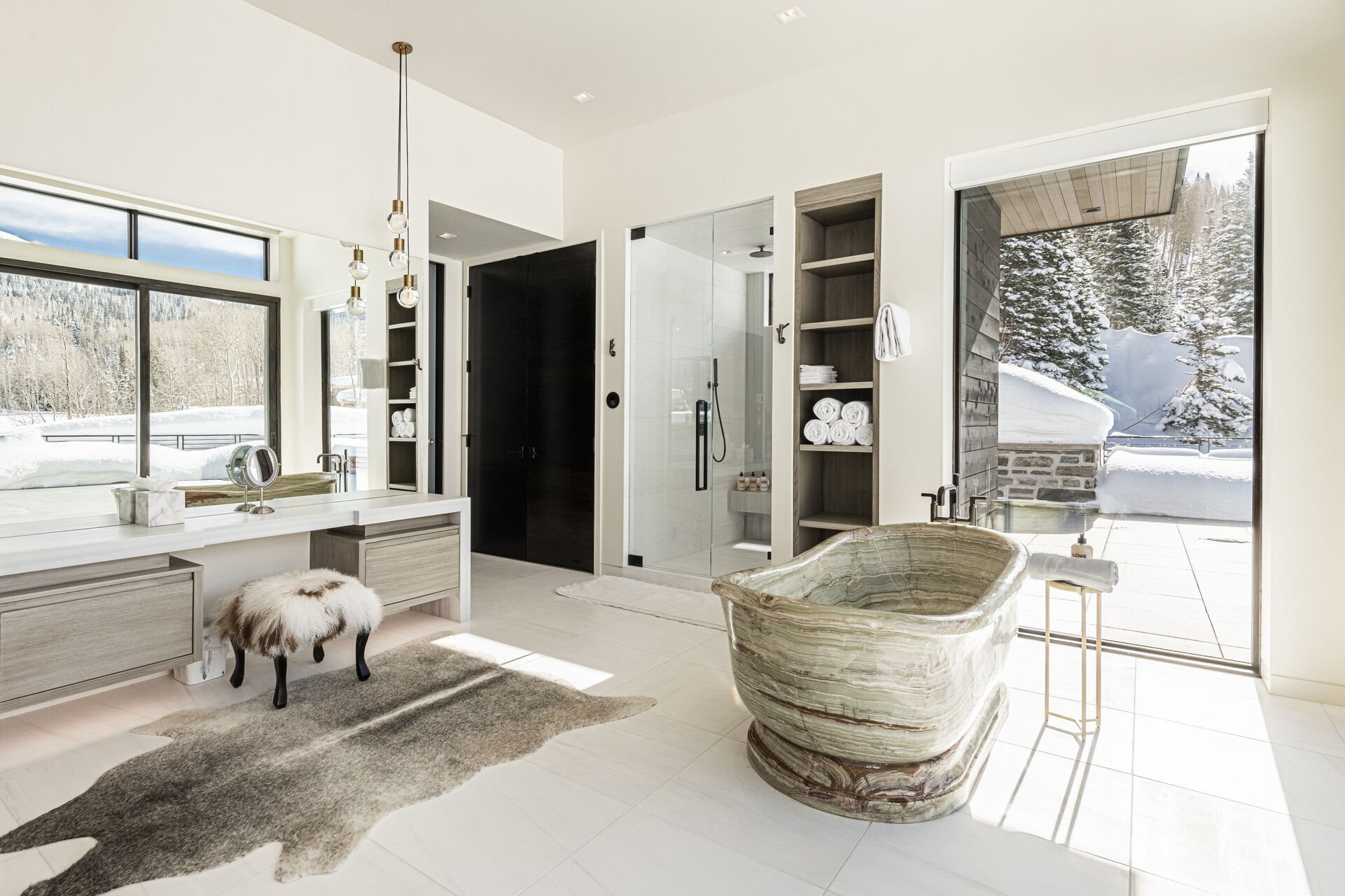 Grand master en suite with a steam shower, laundry closet, make-up area and walk-in closet