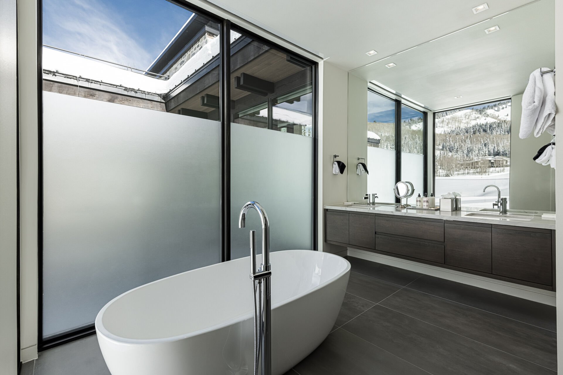 Master en suite 3 with a steam shower, free-standing tub and two sinks